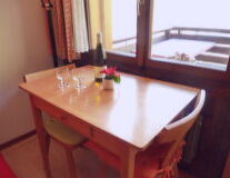 a dining room table in front of a mirror